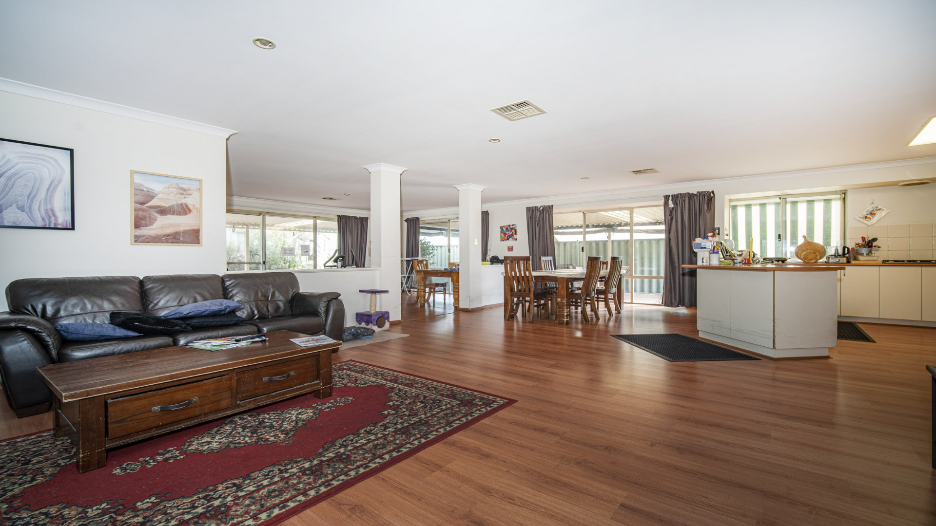 --Open plan lounge, dining and kitchen area.--