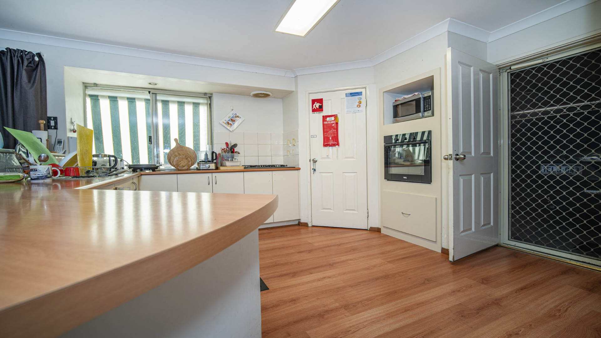 --Kitchen with ample bench space, a large pantry and an oven.--