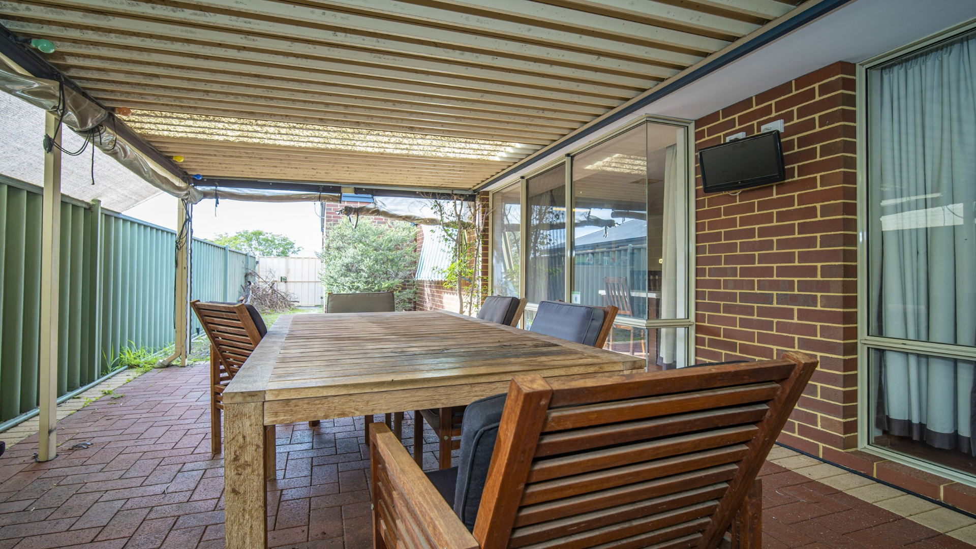 --Undercover outdoor area with outdoor dining set.--
